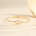 Adjustable gold-plated bangle featuring a sparkling diamond-encrusted initial D design. - Style D
