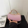 Elegant pink textured evening clutch bag with chic golden metal handle and chain strap - Pink