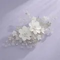 Elegant bridal hair comb featuring white matte ceramic flowers and shimmering crystal accents - Travel Photoshoot Timeless Hair Comb HS-J6097