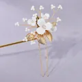 Elegant bridal hair fork featuring white flowers and gold leaves on purple fabric - Bridal Photoshoot Hair Pin HS-J6706G