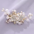 Elegant handmade bridal hair comb featuring white ceramic flowers, gold leaves and pearls - Versatile Dating Hair Clip HS-J7070G
