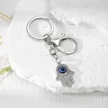 Llavero Mano de Fátima con ojo turco azul y cristales brillantes - Mano De Fátima Mediana Plateado