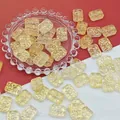 Close-up of rectangular golden liuli beads with floral pattern for DIY jewelry crafts - Golden (L114# Relief Tag)