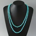 Vintage double-layer turquoise bead necklace with handmade knots displayed on a bust. - 8mm Round