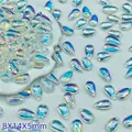 Close-up of 8x14mm iridescent glass teardrop beads for DIY craft jewelry making projects - AB Color