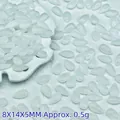 Detailed view of 8x14mm opalescent white teardrop glass beads for DIY jewelry making - 8x14x5mm / White