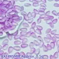 Detailed macro view of 8x14mm purple teardrop glass beads for DIY jewelry making - Purple