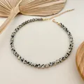 Close-up of Dalmatian jasper spotted bead necklace with golden extender chain. - Leopard Pattern Round Bead Strand (38+5cm) / One Size