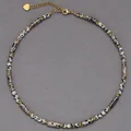 Detailed view of a handmade dalmatian jasper stone necklace with gold-tone accents - Leopard Pattern Tube Beads (38+5cm) / One Size