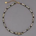 Close-up detail of Minimalist Dalmatian Jasper beaded necklace with leopard pattern - Agate and Leopard Pattern Tube Beads (38+5cm) / One Size