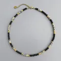 Close-up of handmade stone beaded necklace with leopard print and gold spacers. - Gold Spacers, Abacus Beads and Leopard Skin Jasper (38+5cm) / One Size