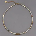 Detailed view of spotted stone bead necklace with gold spacers and heart charm - Gold Spacers and Leopard Pattern Spacers (38+5cm) / One Size