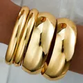 Statement chunky gold bangle set with high-shine polished metallic finish for women - 6649901HB