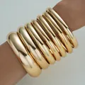 Set of chunky shiny gold-finished metallic smooth bangles for bold women's fashion jewelry - 6779401HB