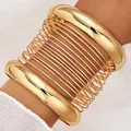 Elegant gold-tone fashion metal bracelet set featuring smooth and spiral coil designs. - 6801701HB