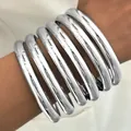 Minimalist exaggerated chunky silver metal bangle set with a smooth polished finish - 6815602HB