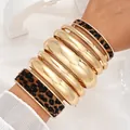 Chic gold metallic smooth bangle bracelet set featuring leopard print textured accents - 6794801HB