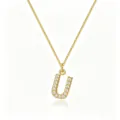 Close-up of gold-plated letter U pendant with cubic zirconia on a box chain - Letter U