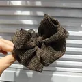Elegante molletta per capelli con fiocco a pois marroni in tessuto leggero e testurizzato - Clip a Banana a Pois / Pois Caffè
