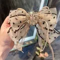 Elegante fermaglio per capelli a fiocco in organza a pois con strass e nastri luminosi - Fiocco di Cristallo a Pois / Champagne