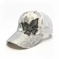 Close-up of silver sequin baseball cap with rhinestone butterfly design and mesh back - White / Adult, Hat Circumference 58cm Adjustable