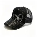 Close-up detail showing the rhinestone butterfly and sequined brim on a mesh baseball cap. - Black / Adult, Hat Circumference 58cm Adjustable