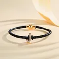 Braided black leather bracelet featuring a rhinestone initial J charm with magnetic clasp - Letter J (PSL221--J)