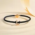 Braided black leather bracelet featuring a gold crystal-encrusted letter L and magnetic clasp - Letter L (PSL221--L)