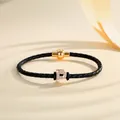 Braided black leather bracelet with gold magnetic clasp and sparkling iced out letter P charm - Letter P (PSL221--P)