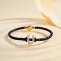 Black braided leather bracelet with gold rhinestone initial U and magnetic clasp - Letter U (PSL221--U)