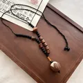 Retro ketting in nieuwe Chinese stijl met natuurlijke zaadhanger en kralen - Houten Kraal Bodhi Halsketting
