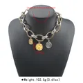 Macro detail view of chunky twisted cable chain necklace with vintage coin pendants - Antique Gold & White K
