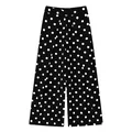 Detailed view of black and white polka dot wide leg pants with pleated waist. - Black With White Polka Dots