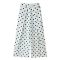 Detail of white wide-leg trousers featuring black polka dots and front pleats - White with Black Polka Dots
