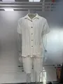 White hollow textured short sleeve shirt and matching shorts set on transparent mannequin - As Pictured / M