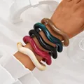 Set of colorful chunky wavy acrylic bangles featured on a wrist for a stylish look - 5-Piece Irregular Wave Bangle Set (6774201) / Multicolor Marble Combo