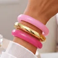 Set of three chunky acrylic and gold metallic bangles in vibrant pink for stylish women - Thickened Round Bangle Set (6788503) / Three-Piece Set / Gold/Light Pink/Rose Pink