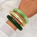 Elegant set of 3 acrylic bangles featuring emerald green jade and polished gold finishes - Minimalist Chunky Bangle Set (6788504) / Three-Piece Set / Light Green/Gold/Dark Green