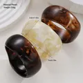 Set of three irregular resin bangles with marble texture in amber and cream tones - Wide Open Bangle Set (6774001HB) / Amber & Cream Marble