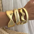 Gold-toned acrylic irregular chunky bracelet set with high-end polished finish. - Gold Exaggerated Geometric Open 4-Piece Bangle Set (6806401HB) / Gold