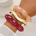 Set of three chunky irregular acrylic and gold metal bangles in red and nude tones - Irregular Wave Open Bangle 3-Piece Set (6807701) / Set of 3 / Dark Red Flesh Gold Combo