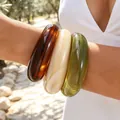 Set of 3 chunky acrylic bangles in glossy amber, cream and olive green tones for women - Acrylic Irregular Open Bangle 3-Piece Set (6808501) / Set of 3 / Dark Amber Cream Beige Olive Green Combo