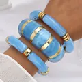 High-end blue marbled acrylic chunky bracelet set with elegant gold-toned metal accents - Sky Blue Irregular Open Bangle Set (6644204HB) / Three-Piece Set / Sky Blue Marble/Gold