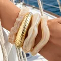 Chunky irregular beige acrylic and gold-tone ribbed bangle bracelet set for women - Creamy Wave Spiral Bangle Set (6810801) / Four-Piece Set / Creamy/Beige/Gold