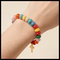 Handmade colorful acrylic bead bracelet featuring a gold cross pendant charm on wrist - Multicolor Cross Beaded Bracelet (6804001HB) / Rainbow