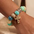 Colorful acrylic beaded bracelet with a textured gold cross charm for stylish daily wear - Blue Tone Cross Beaded Bracelet (6804003HB) / Blue + Beige + Green