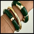 Stackable dark green acrylic and polished gold metal bangle set for a minimalist look - Stacked Bamboo Bangle Set (6764605HB0000) / Dark Green Set