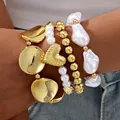 Bohemian jewelry set featuring gold discs, pearl beads, and baroque pearl accents. - Heart Baroque Pearl Bracelet Set (6751801HB) / Four-Piece Set / Gold Pearl Combination