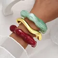 Set of irregular wavy acrylic and gold cuff bracelets in red, green, and shiny gold finish - Wave Irregular Open Bangle (6807702) / Three-Piece Set / Red Gold Green Combo