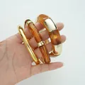 Amber acrylic resin and gold-tone metal chunky bracelet set for a minimalist aesthetic - Minimalist Niche Designer Bangle 3-Piece Set (6764604HB) / Gold Combination
